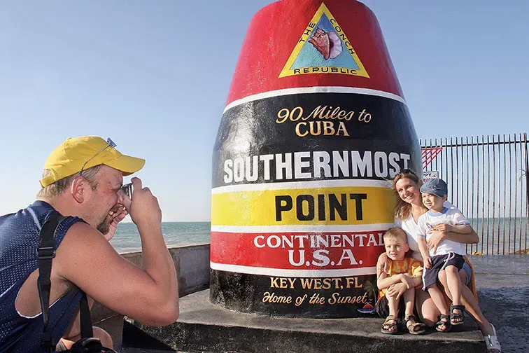 Family at Southernmost Point in Key West, Florida
