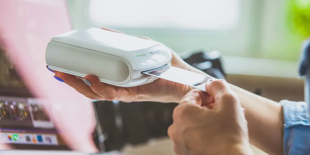 Woman Holding In Hands Instant Photo with place for photo of Your choice Courtesy CatwalkPhotos/Shutterstock