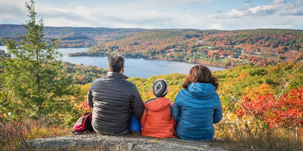 Family Overlooking a Lake in the Fall; Courtesy of Romiana Lee/Shutterstock.com