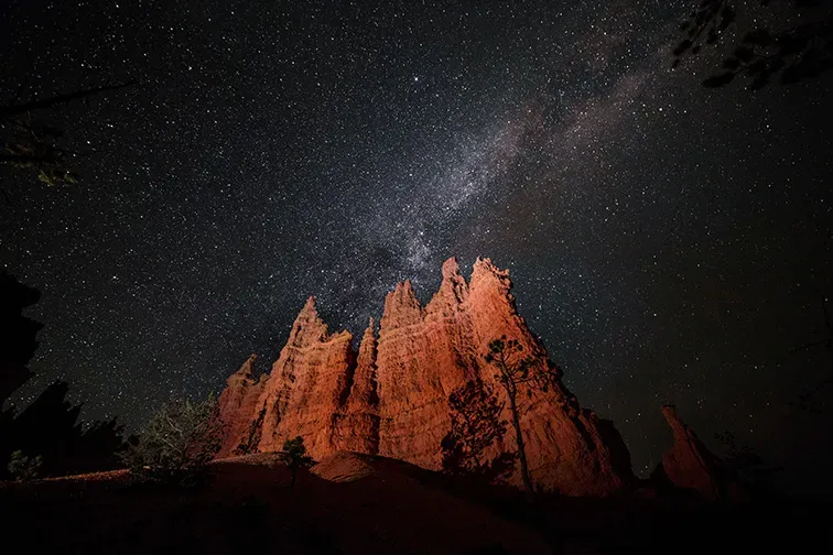 starry sky over bryce national park in utah; Courtesy of ericharris/Shutterstock
