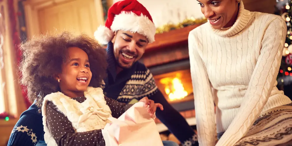 Family Opening Holiday Gifts; Courtesy of Lucky Business/Shutterstock.com