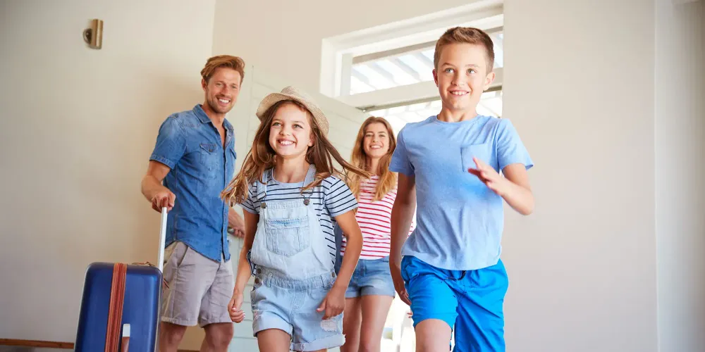 Family at Vacation Rental; Courtesy of Monkey Business Images/Shuttesrtock.com