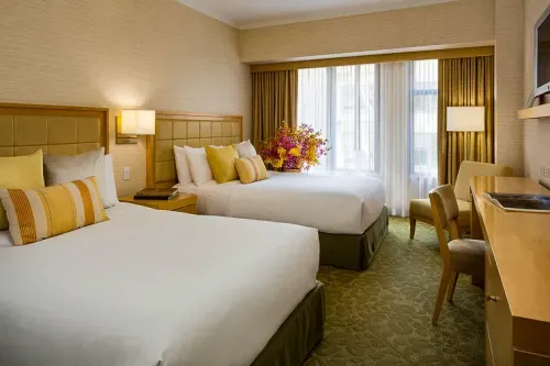 The Orchard Garden Hotel guest room; Courtesy of The Orchard Garden Hotel