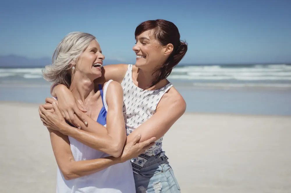 Woman with daughter on beach