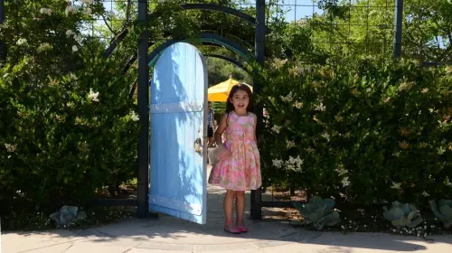 Child walking through door at the The Huntington Library, Art Museum, and Botanical Gardens