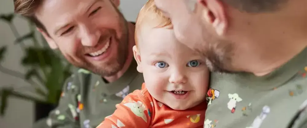 Two men and baby wearing Hanna Anderson Star Wars Halloween Matching Family Pajamas​