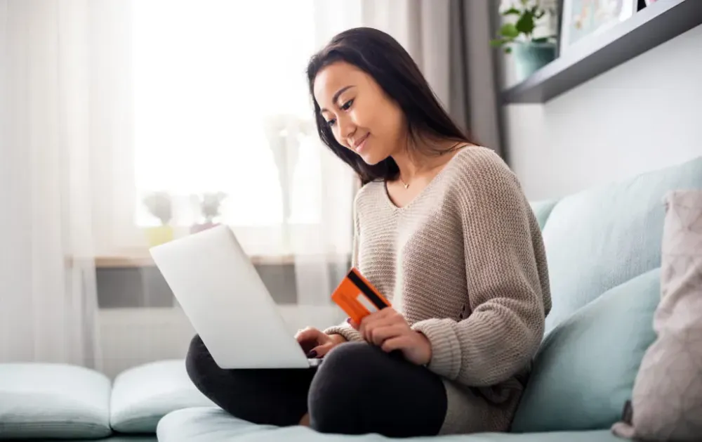 Woman making online purchase on laptop