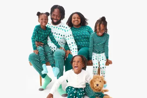 Family wearing holiday PJs from Primary