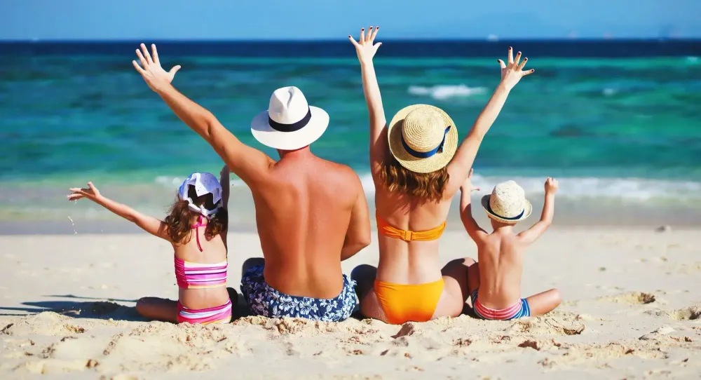 Family at beach having fun
