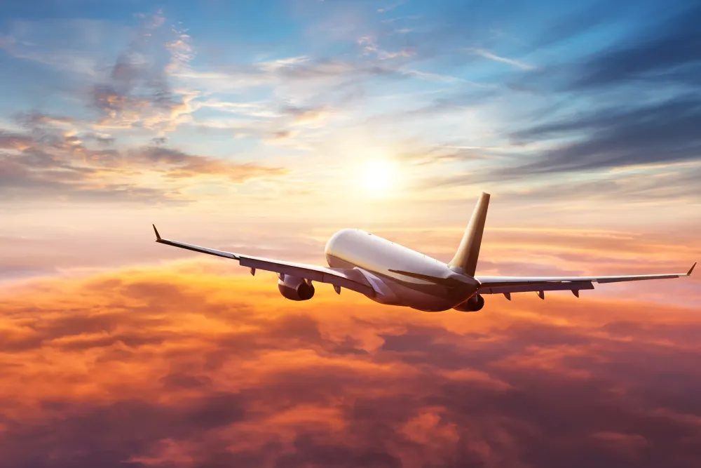  Downloaded Passengers commercial airplane flying above clouds 